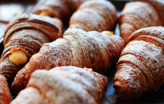 A tray of freshly baked croissants.